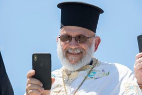Greek priest with iPhone
