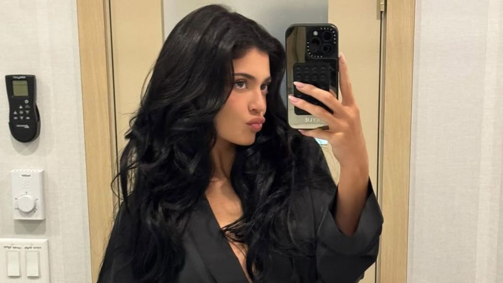 Kylie Jenner breast implant pink dress kylie cosmetics procedure