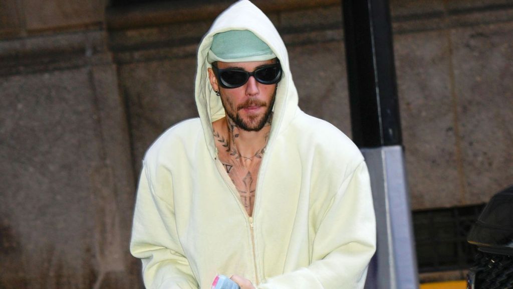 Justin Bieber standing on business