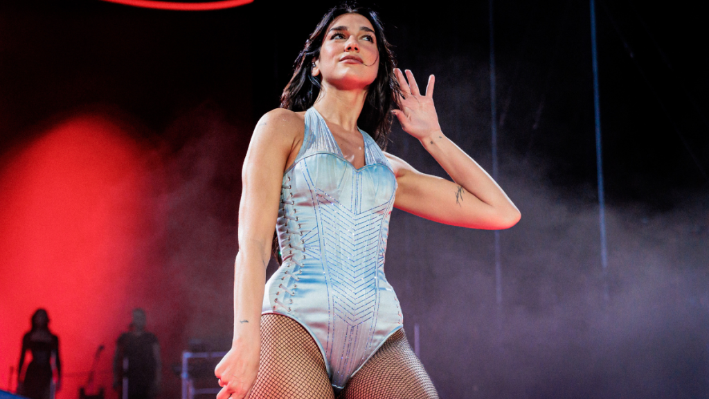 Dua Lipa Goes Braless in Sheer Burgundy Dress for Her Birthday