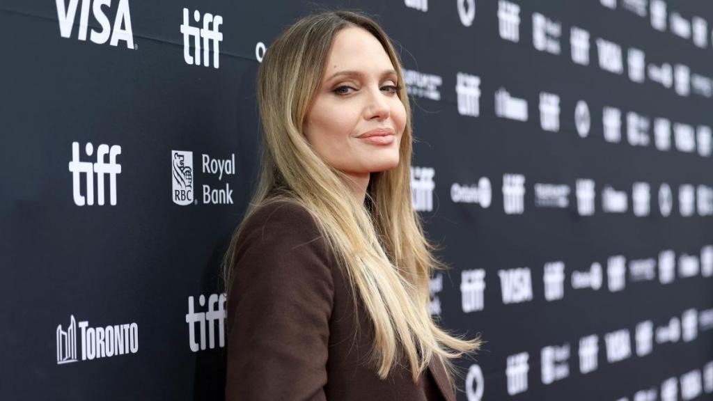 Angelina Jolie Blends Business With Fun in Trench Coat Dress at TIFF