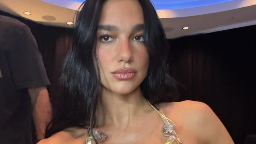 Fans React to Dua Lipa Wearing Shiny Gold Corset With Fishnet