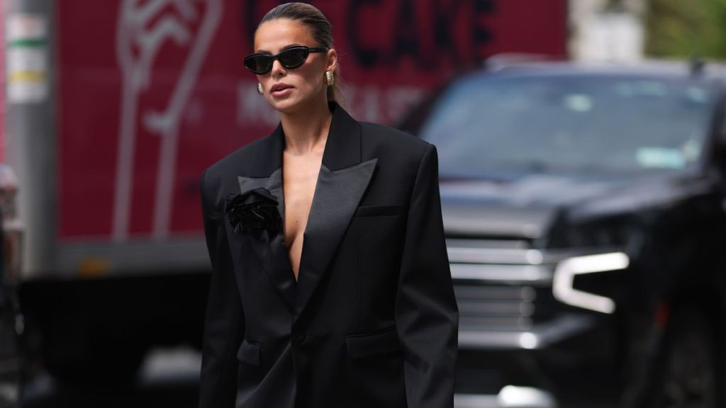 Video: Brooks Nader Risks Wardrobe Malfunction by Going Braless Under a Coat