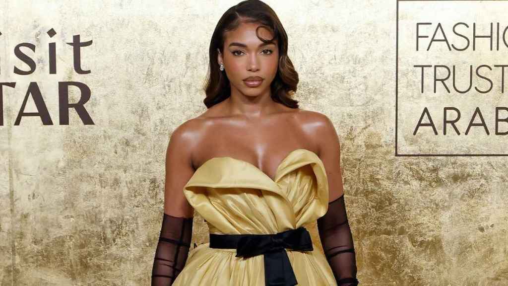 Lori Harvey's Thigh-High Slit Dress Adds Bold Twist to Her Poses