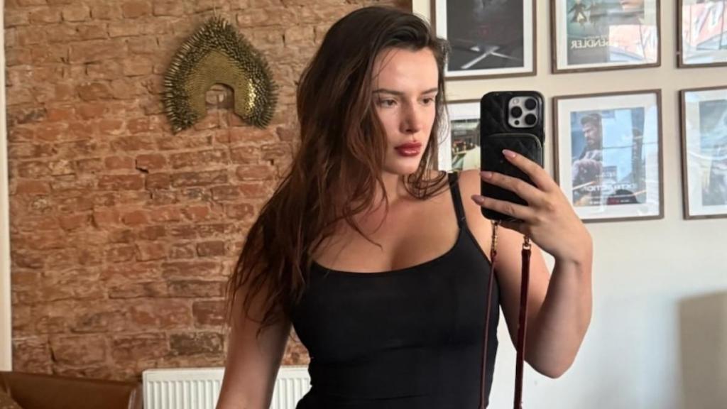 Bella Thorne Lying Down on the Beach in Thongs Will Make You Look Twice