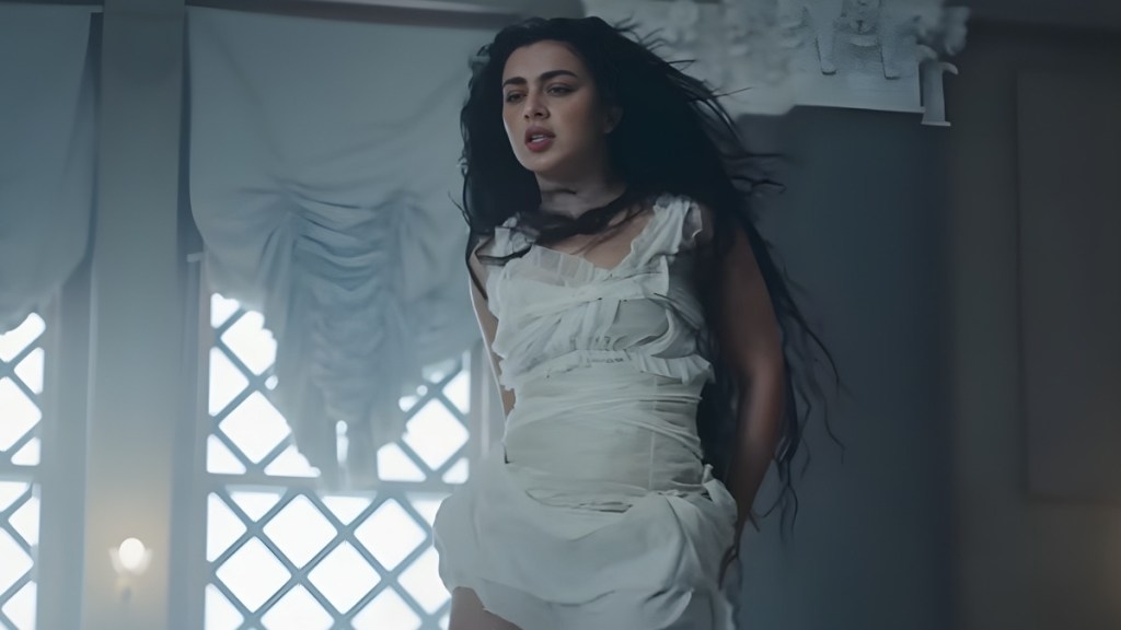 Charli XCX Lying Down in Sheer White Dress Will Make You Look Twice