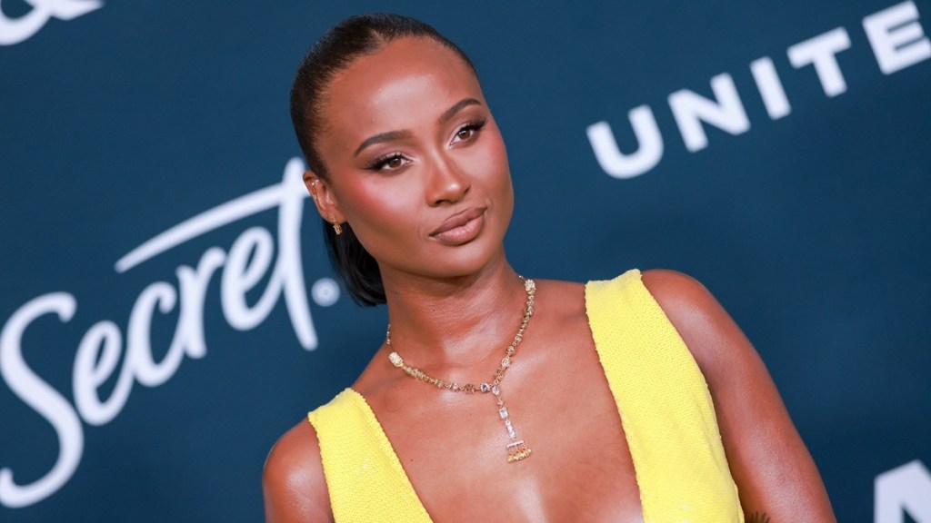 Travis Kelce's Ex Posing in Bold Dress With Shaq Goes Harder Than Expected