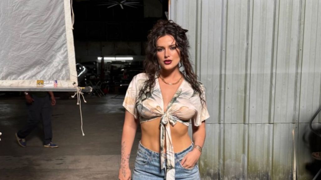 Bella Thorne Showcases Toned Midriff in Crop Top