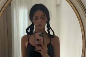 Cindy Kimberly’s Thong Peeks as She Poses in Bed in Only Fur Coat