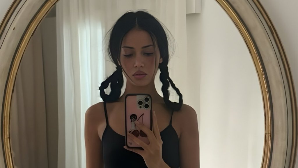 Cindy Kimberly’s Thong Peeks as She Poses in Bed in Only Fur Coat