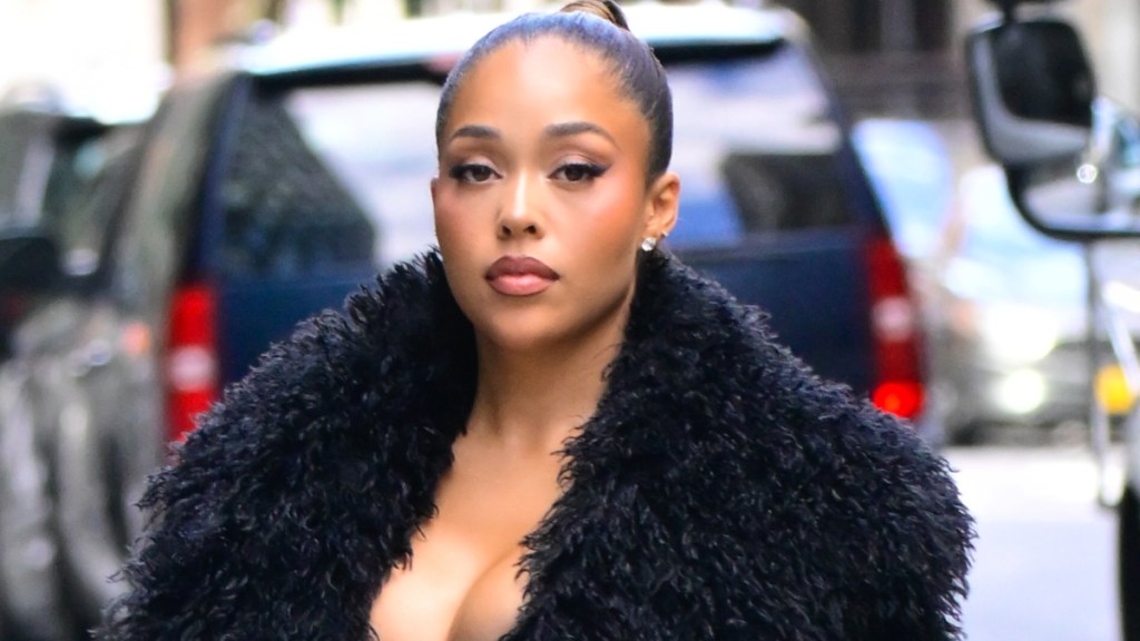 Jordyn Woods' Fur Look Comes With a Sheer Bra Surprise