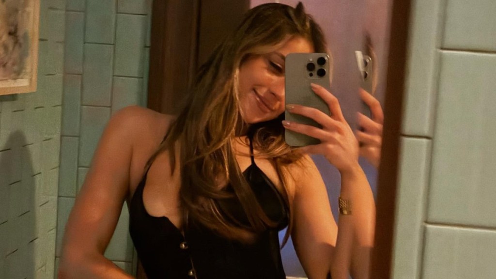 Tate McRae's Leather Coat Look Leaves Just Her Head Visible