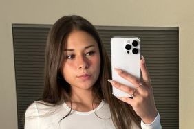 OnlyFans' Sophie Rain Lying Down in Unzipped Bodysuit Will Distract You