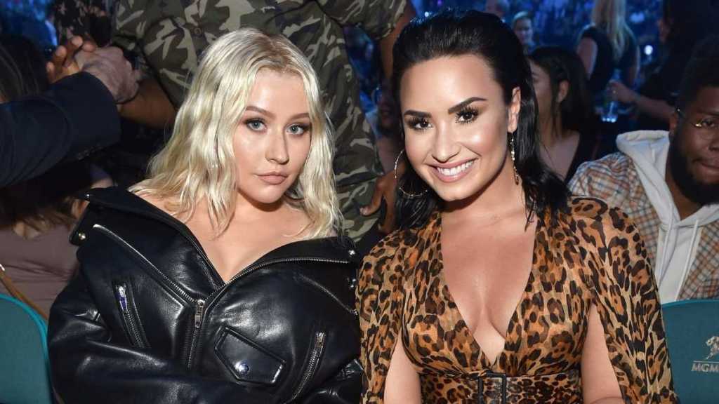 Demi Lovato & Christina Aguilera Snuggling in Their Fur Coats