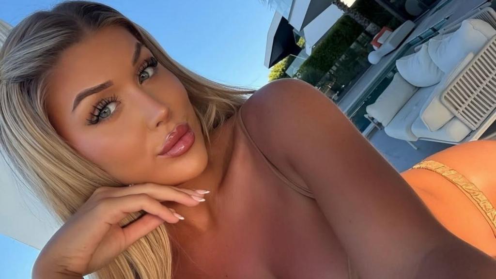 Eve Gale Enjoys Winter Sun in Bold Sheer Dress