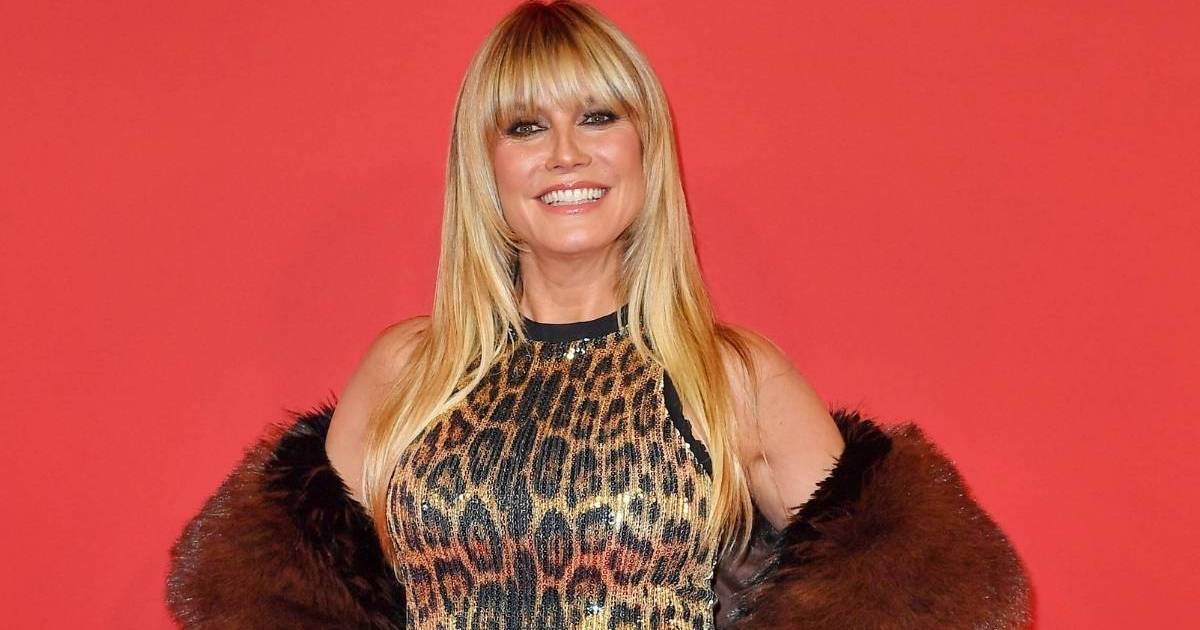 Heidi Klum Poses on Train Tracks in Fur Coat To Tease Music Video