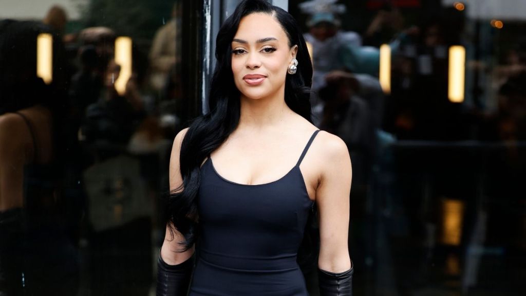 Influencer Kristy Sarah Poses in 'Revenge' Burgundy Dress