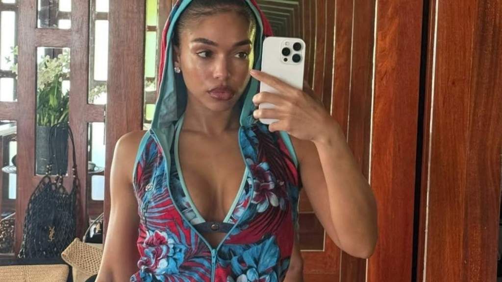 Lori Harvey Sitting in Floral Bikini Is Hard To Ignore