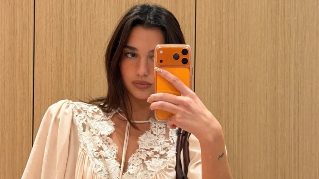 Dua Lipa's Low-Cut Top Exposes Lacey Bra