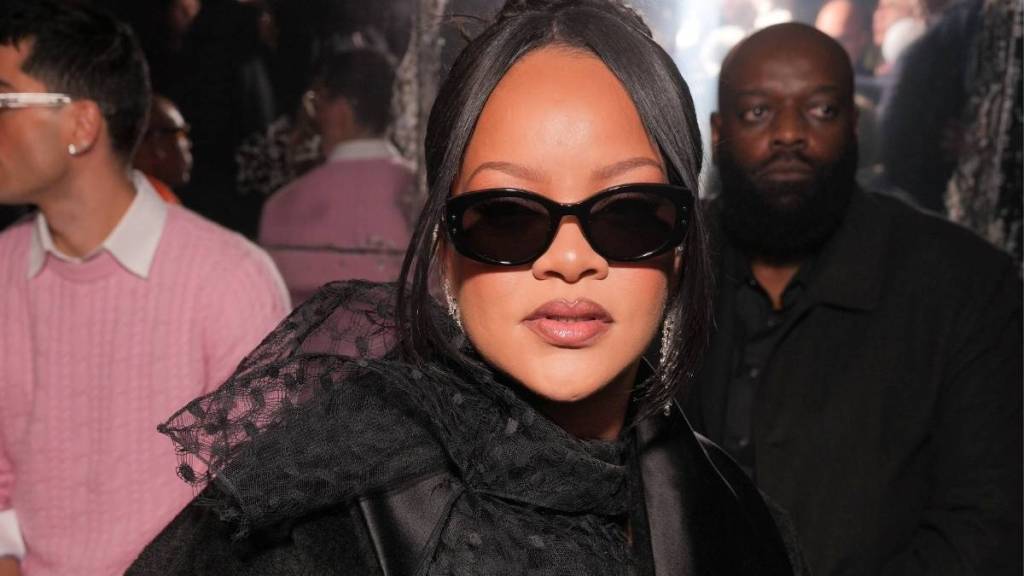 Rihanna Models Chic Black Dress & Fur Coat for Savage X Fenty Party