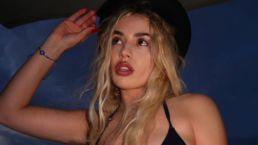 Ava Max Rings in 2026 in Stringy Bikini Top & Towel
