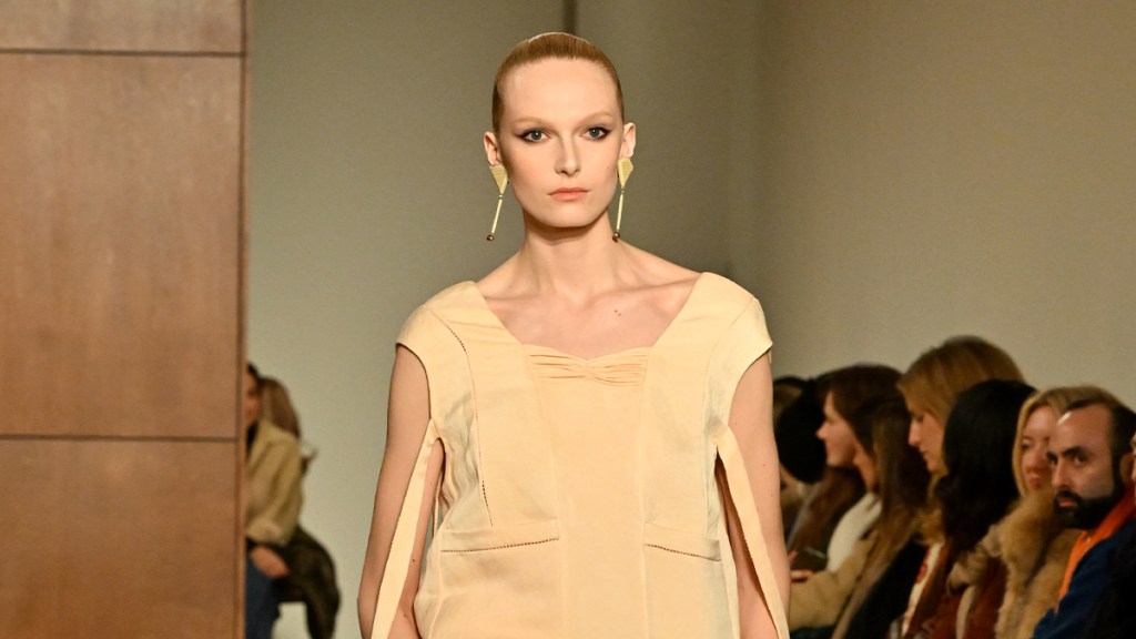 Alex Consani's Tory Burch Dress Has Straps Hanging All Over