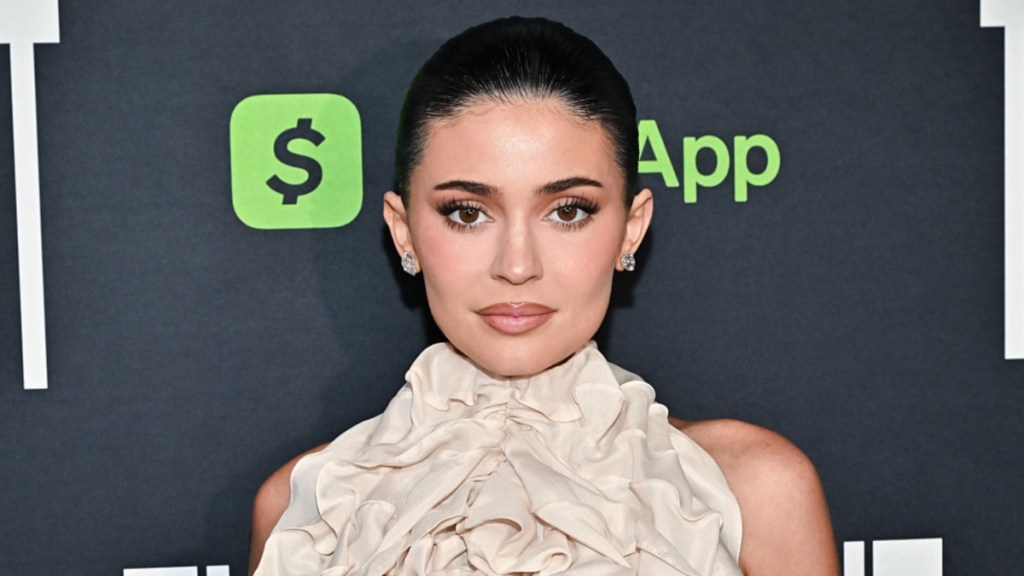 Kylie Jenner Pairs Sheer Top With Micro Mini for Kylie Cosmetics