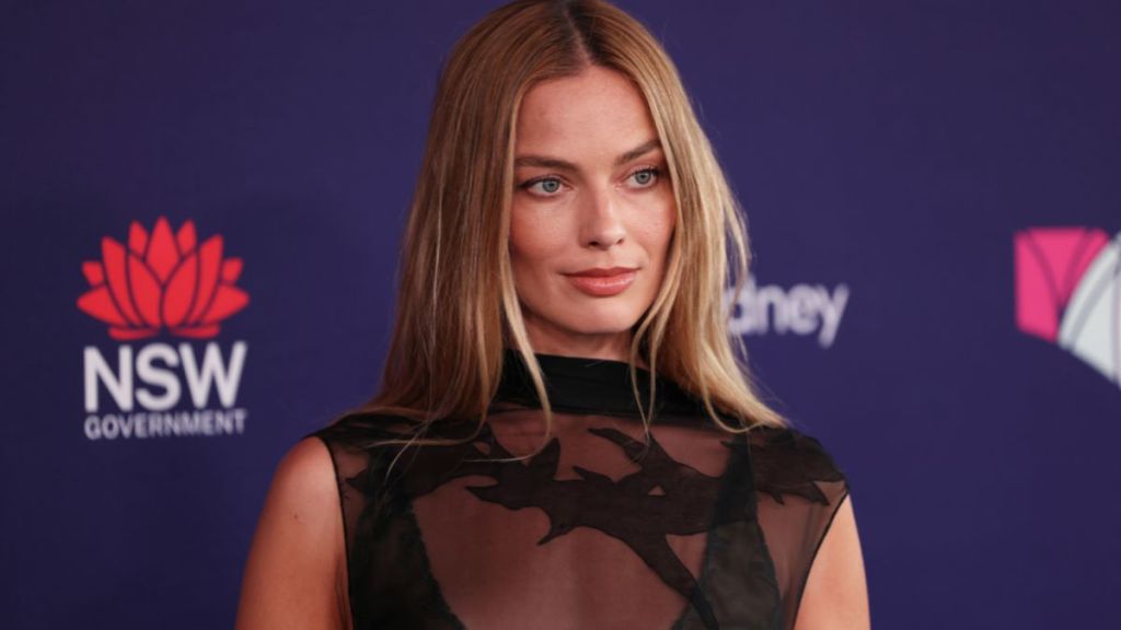 Margot Robbie’s Fully Sheer Dress Boasts a Micro Miniskirt for Press Tour