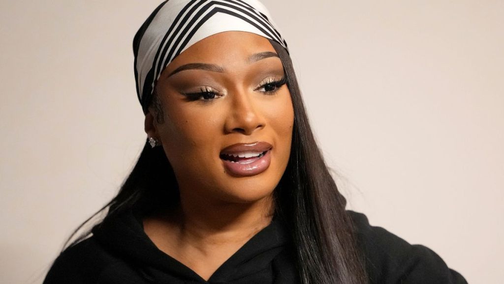 Megan Thee Stallion Amps up Thom Browne Look With Bold High Slit Skirt