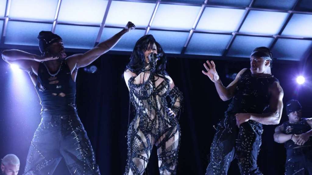 Cardi B Performs for SNL in Sheer Strappy Catsuit