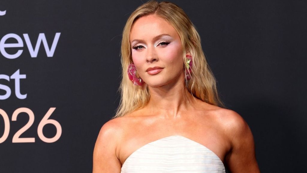 Zara Larsson’s Bikini Top Is Sparkly With Charms Hanging From It at Show