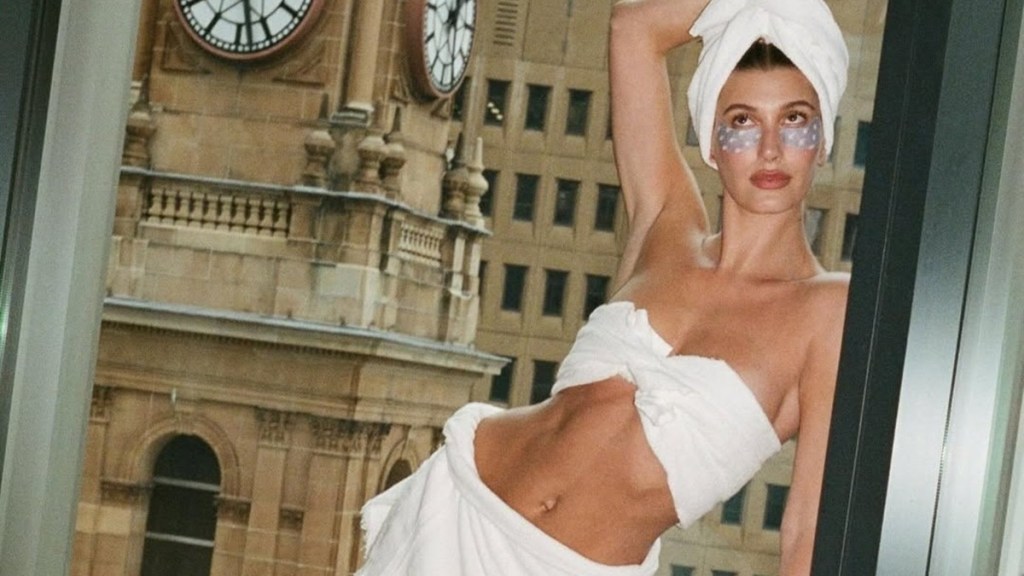 Hailey Bieber Goes Bold With Towel as Tube Top & Mini Skirt in Rhode Photo Dump