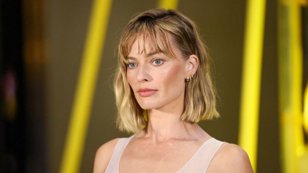 Margot Robbie’s Sheer Top Style Makes a Splash at Paris Fashion Week