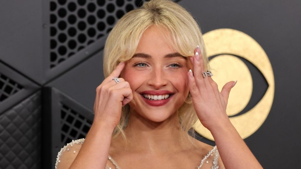 Sabrina Carpenter Keeps It Bold in Halter Neck Bodysuit on Stage