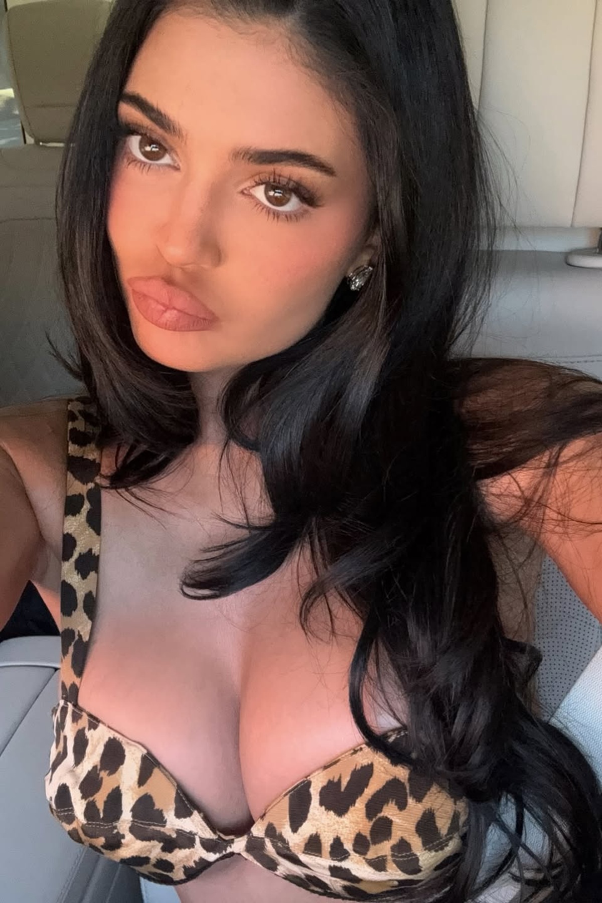 Kylie Jenner leopard print bikini top selfie Instagram March 2026