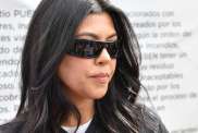Kourtney Kardashian Strikes Feisty Pose in Silky Nightdress Amid Coachella Collab