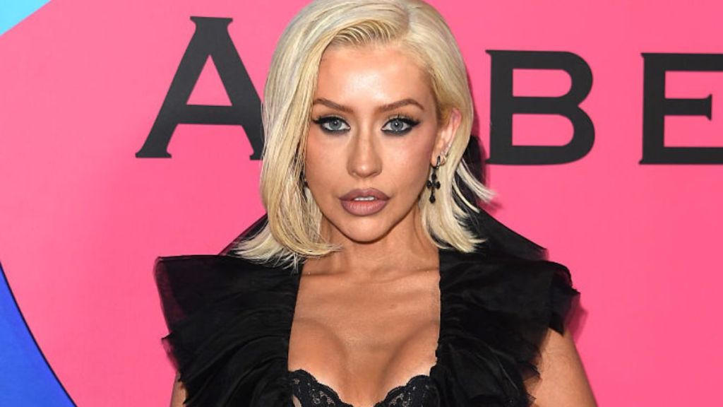 Christina Aguilera Lets Her Lingerie Peek from Deeply Plunging Top