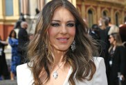 Elizabeth Hurley Nearly Spills Out of a Plunging Beach Dress Cut Shockingly Low