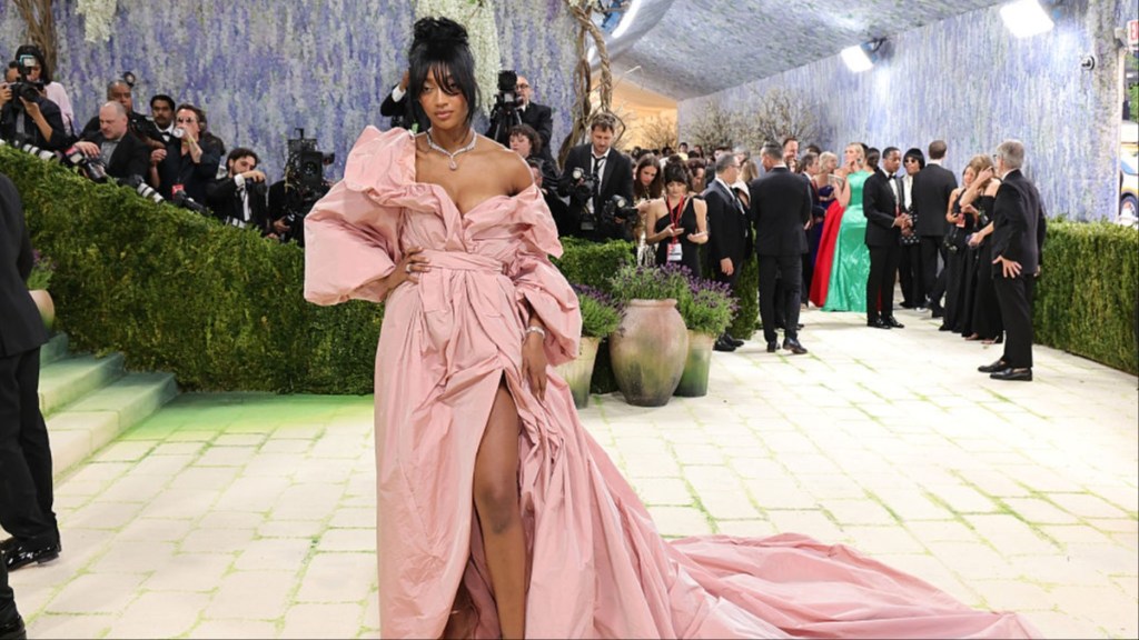 Angel Reese's Cleavage-Baring Dress Features a Thigh-High Slit