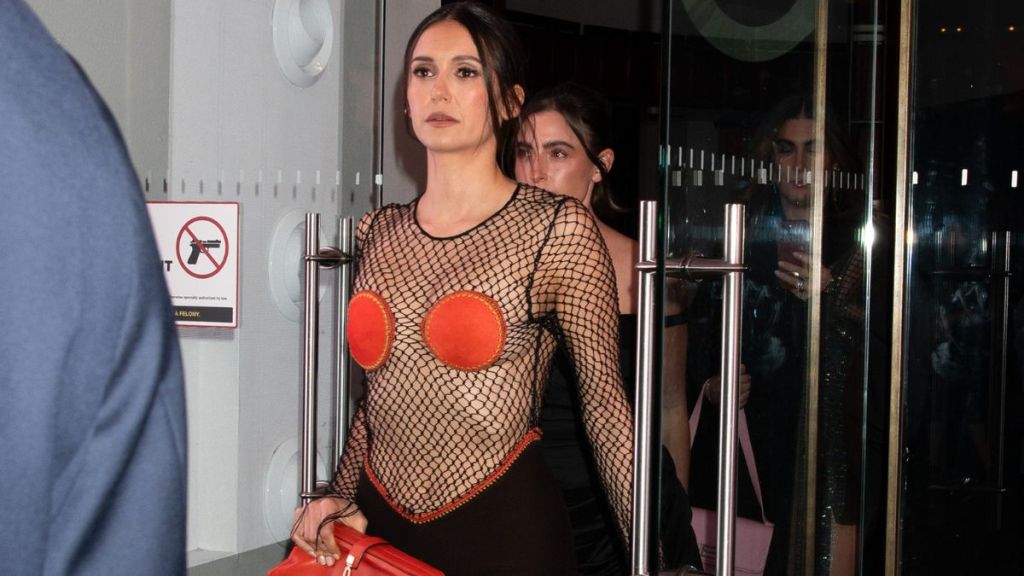 Nina Dobrev Goes Braless Under Fishnet Dress