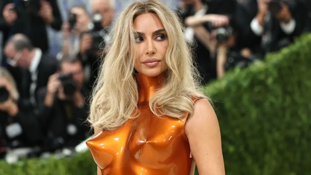 Kim Kardashian’s Cleavage-Baring Robe Is a Little Too Loosely Tied