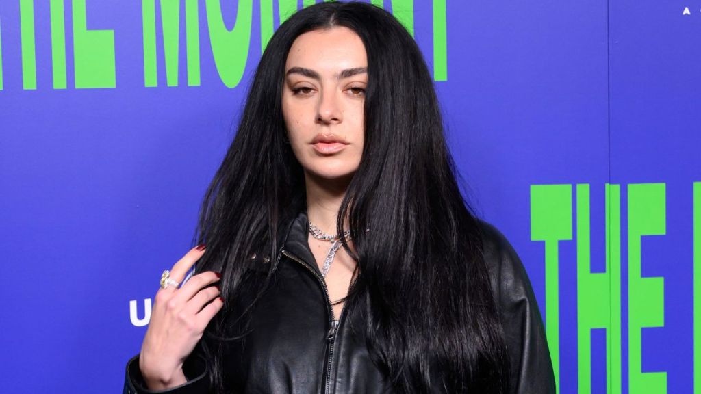 Charli XCX’s Jacket Can Barely Contain Her Daring Bra Look