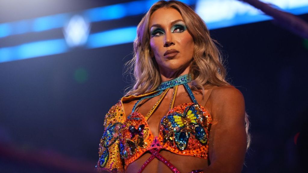 WWE’s Charlotte Flair Nearly Pops Out of a Strapless Bikini Barely Clinging to Her Curves