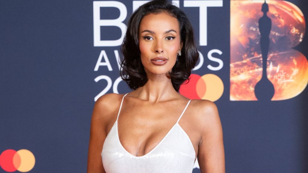 Maya Jama Flaunts Curves & More in Cutout Swimsuit Hanging by a Strap