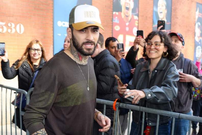 Zayn Malik Dodges Water Bottles at Public Event