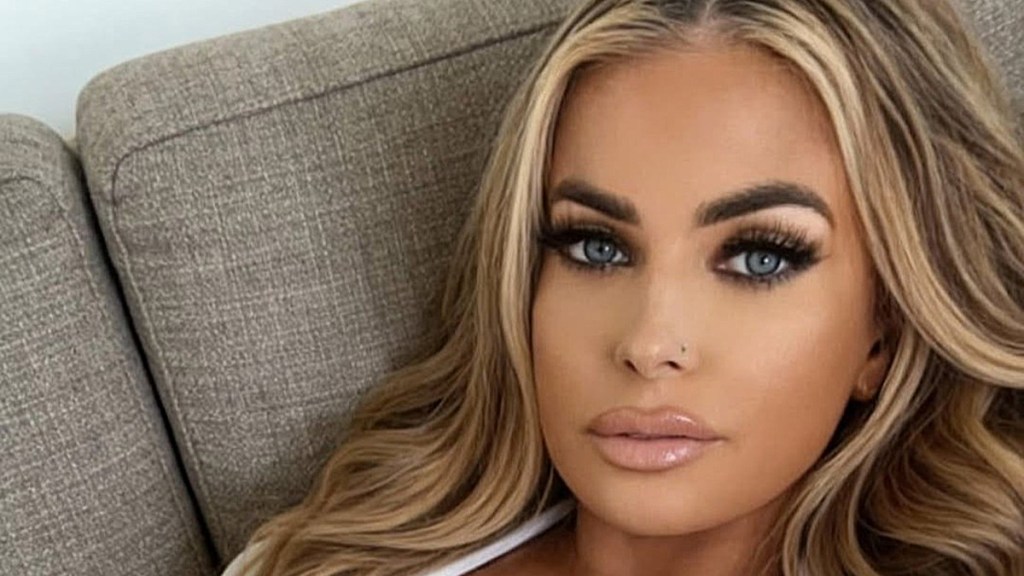 Carmen Electra’s Tiny Bikini Top Keeps Eyes Away From Her Thong Slip-Out