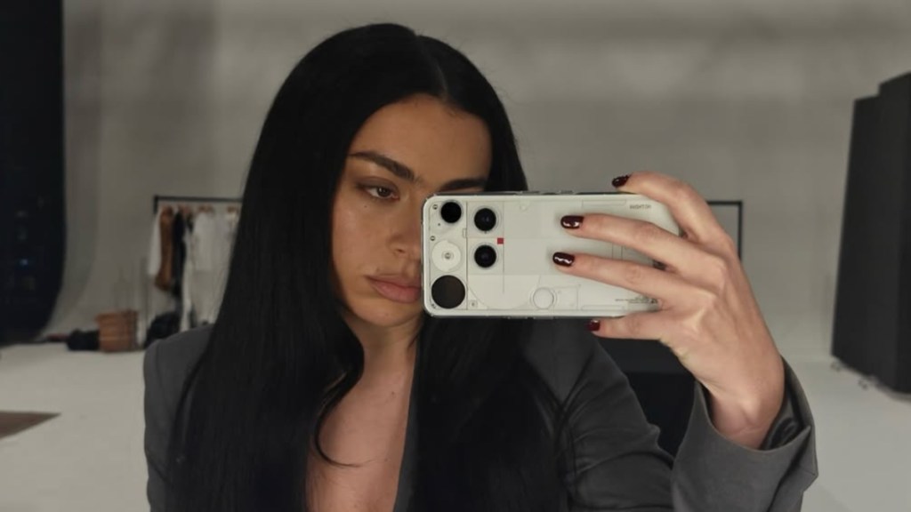 Charli XCX’s Sheer Bra Peeks Through a Boldly Unbuttoned Shirt