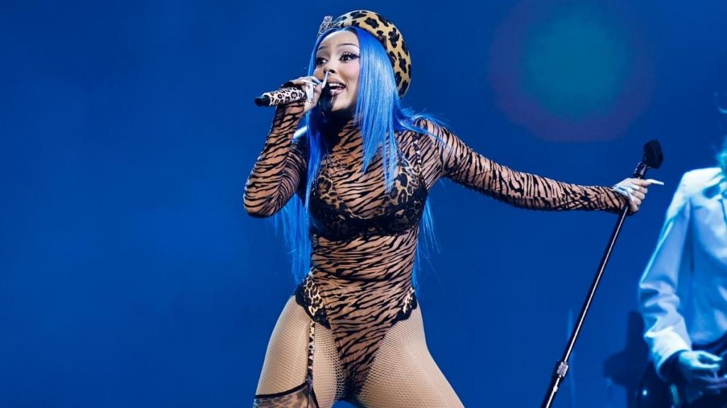 Doja Cat’s Latex Bodysuit Plunges Dangerously Low To Reveal a Surprise