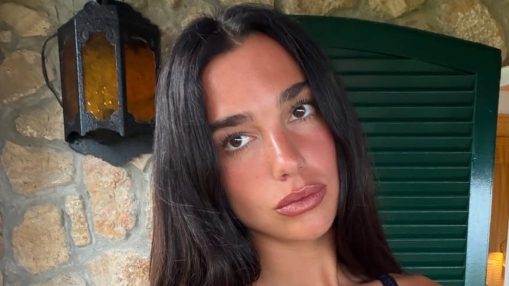 Dua Lipa Packs on the PDA in a Tiny String Bikini on Romantic Beach Escape