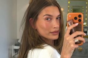 Hailey Bieber Rolls in Sand in Teeny Tiny Bikini